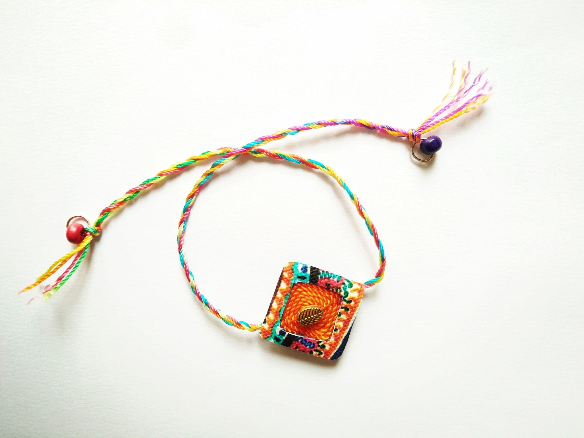 Orange Diamond Shaped Rakhi