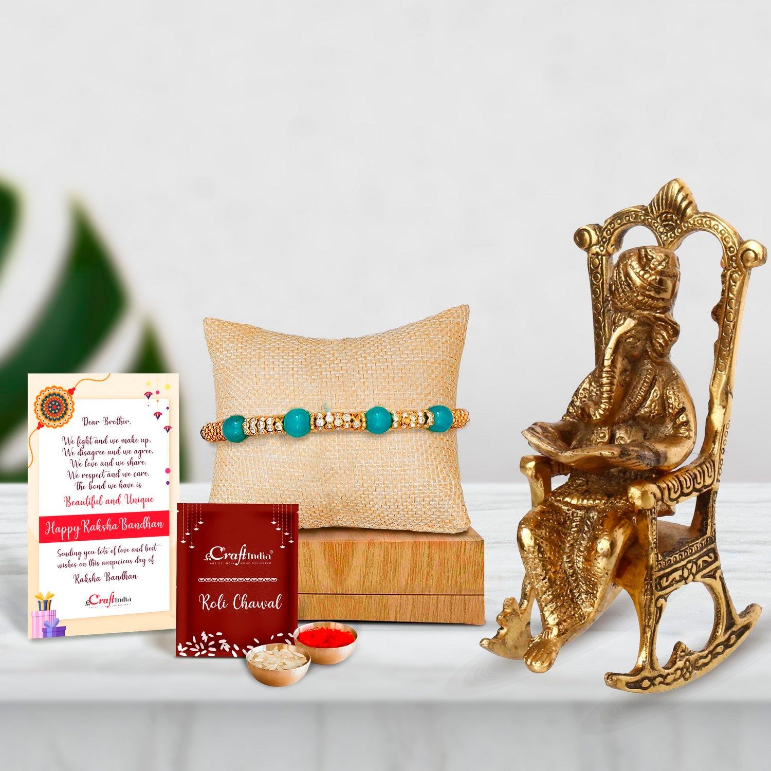Designer Pearl Rakhi with Lord Ganesha on Rocking Chair Antique Showpiece and Roli Chawal Pack, Best Wishes Greeting Card