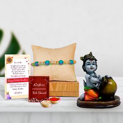 Designer Pearl Rakhi with Decorative Showpiece of Makhan Chor and Roli Chawal Pack, Best Wishes Greeting Card