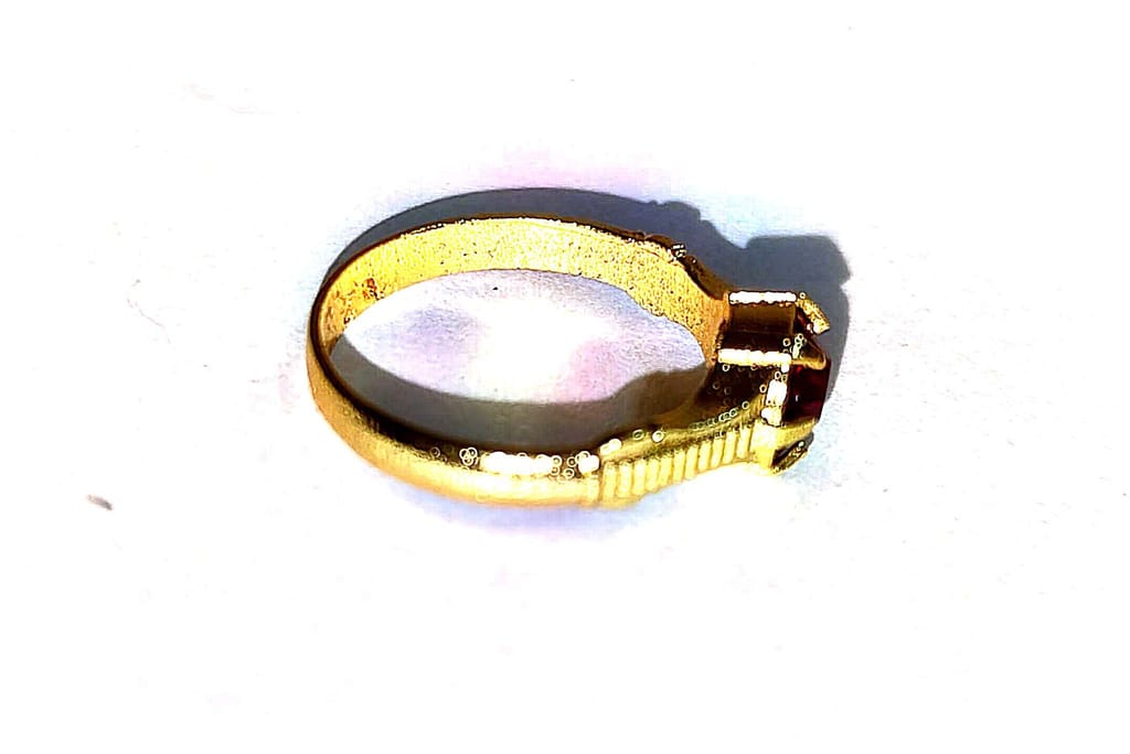 "Stunning Gold Ring with Red Gemstone"