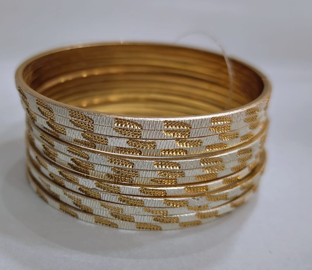 "Exquisite Golden Bangle Set with Silver Etchings"
