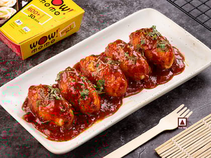 Chicken Himalayan Pan Fried Momo In Schezwan Sauce (Spicy)