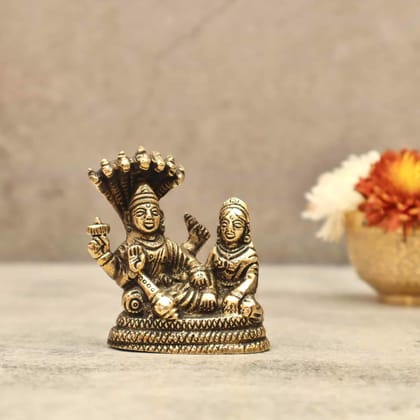 Brass Vishnu Lakshmi on Sheshnag - 3 inch Height | Sacred Brass Idol of Vishnu and Lakshmi on Sheshnag for Divine Grace Brass Vishnu Lakshmi on Sheshnag - 3 inch Height | Sacred Brass Idol of Vishnu and Lakshmi on Sheshnag for Divine Grace