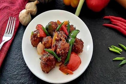 Wok Tossed Schezwan Dumplings