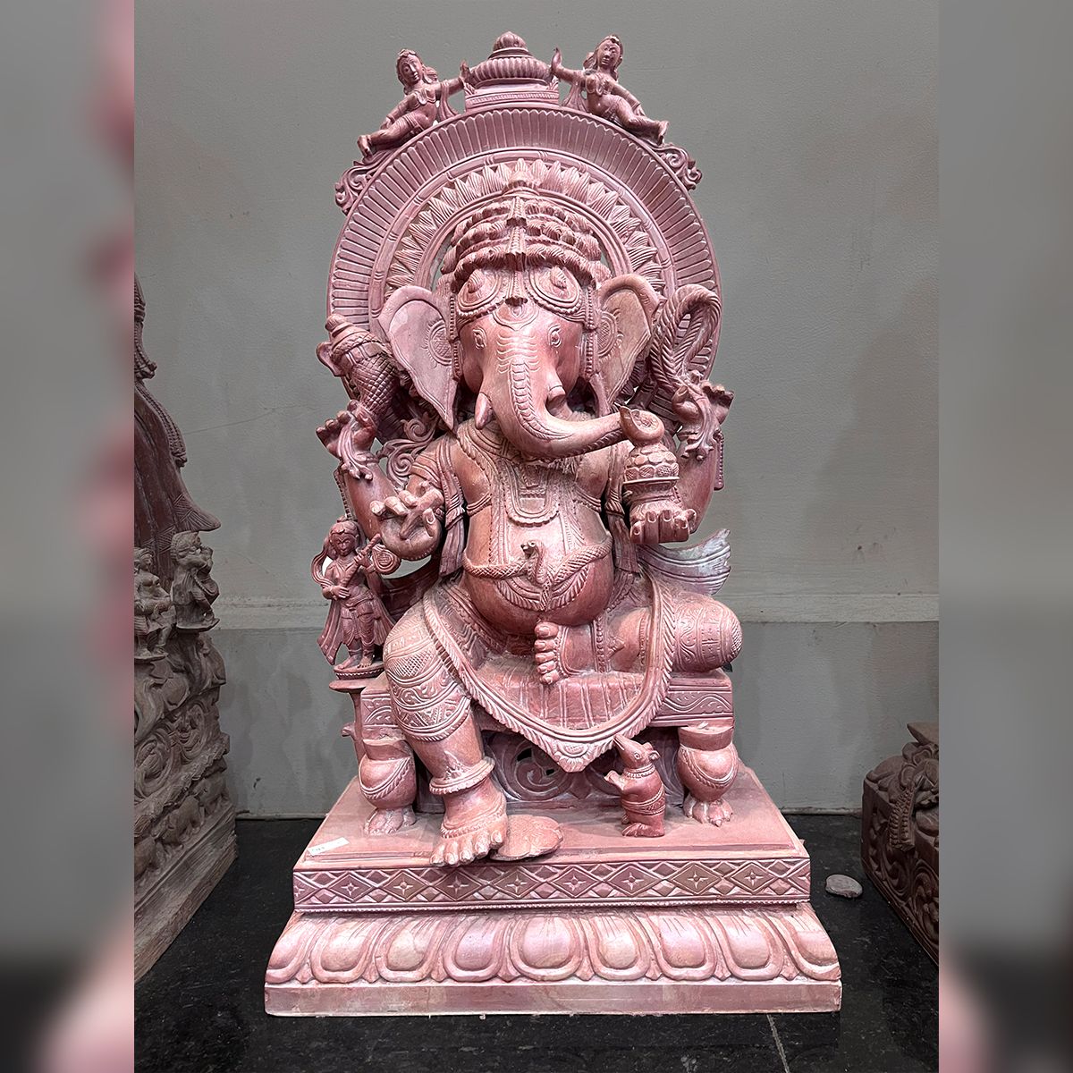 Lord Ganesha on Singhasana Special Red Stone Statue