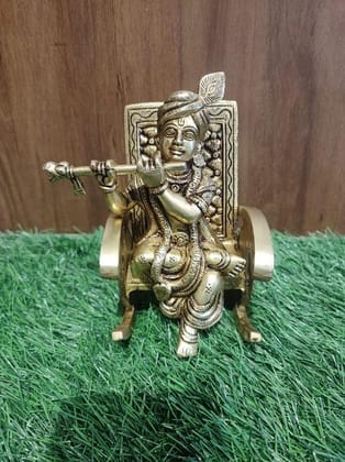 BRASS LORD KRISHNA RESTING ON CHAIR BRASS LORD KRISHNA RESTING ON CHAIR