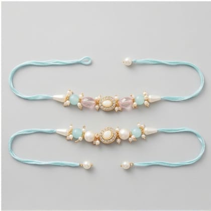 Artisanal Pearl and Stone Designer Rakhi (set of 2) Artisanal Pearl and Stone Designer Rakhi (set of 2)